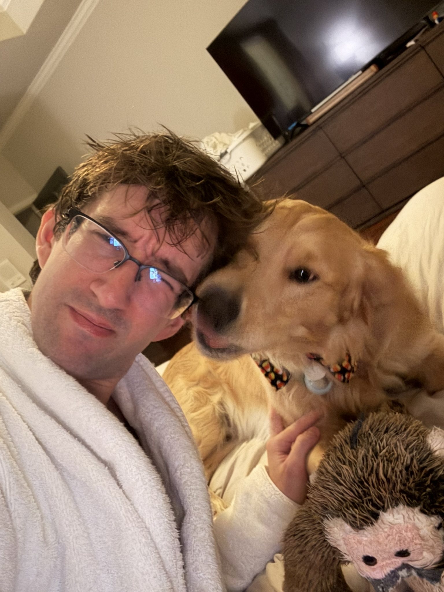 Winnie pressing his face up next to his dad during a selfie.